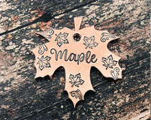 Load image into Gallery viewer, copper maple leaf shaped dog tag with flying leaf design