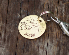 Load image into Gallery viewer, Dog id tag, hand stamped with wolf head, mountains & star design