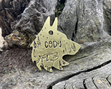 Load image into Gallery viewer, Wolf head dog tag, handstamped with wolf & trees