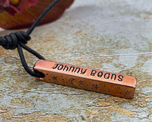 Load image into Gallery viewer, Dog memorial necklace with moon and star design, hand-stamped bar necklace with adjustable leather cord