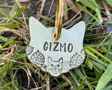 Load image into Gallery viewer, Cat head pet id tag, hand stamped with cute cat and leaves