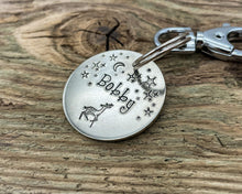 Load image into Gallery viewer, Winter dog id tag, hand stamped with reindeer and stars