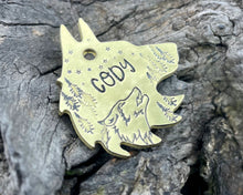 Load image into Gallery viewer, Wolf head dog tag, handstamped with wolf & trees