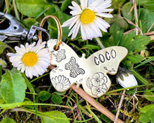 Load image into Gallery viewer, Daisy dog id tag, butterfly shaped pet tag, hand stamped with flowers