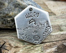 Load image into Gallery viewer, Hexagon dog tag, hand stamped with nautical design, dolphin & lighthouse