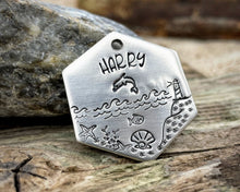 Load image into Gallery viewer, Hexagon dog tag, hand stamped with nautical design, dolphin & lighthouse
