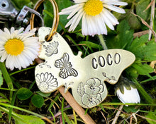 Load image into Gallery viewer, Daisy dog id tag, butterfly shaped pet tag, hand stamped with flowers