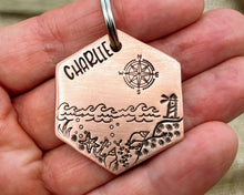 Load image into Gallery viewer, Hexagon dog tag, hand stamped with nautical design, compass & lighthouse