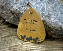 Load image into Gallery viewer, Guitar pick dog tag, hand stamped with 'it was the cat'