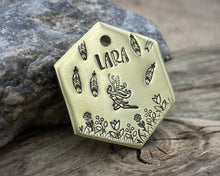 Load image into Gallery viewer, Hexagon dog tag, hand stamped with fairy design, flowers and feathers
