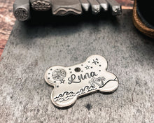 Load image into Gallery viewer, Bone dog id tag with moon and stars, handstamped pet id tag with up to 2 phone numbers or microchipped