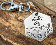 Load image into Gallery viewer, Hexagon dog tag, hand stamped with nautical design, dolphin & lighthouse