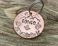 Load image into Gallery viewer, Mountain dog tag, hand-stamped with river, cactus and stars