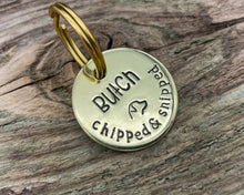 Load image into Gallery viewer, Microchipped dog tag, hand stamped with 'chipped & snipped'