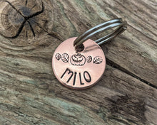 Load image into Gallery viewer, Halloween cat name tag, hand stamped spooky pumpkin and leaves