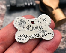 Load image into Gallery viewer, Bone dog id tag with moon and stars, handstamped pet id tag with up to 2 phone numbers or microchipped