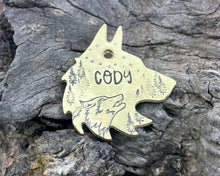 Load image into Gallery viewer, Wolf head dog tag, handstamped with wolf & trees