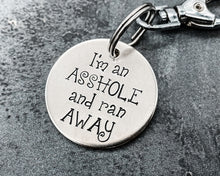 Load image into Gallery viewer, Funny dog tag, hand stamped with 'I'm an asshole and ran away'