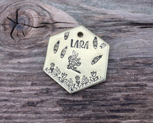 Load image into Gallery viewer, Hexagon dog tag, hand stamped with fairy design, flowers and feathers