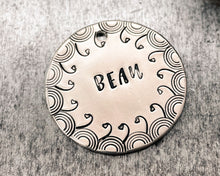 Load image into Gallery viewer, Large dog tag, hand stamped with border design