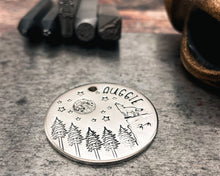 Load image into Gallery viewer, Large dog tag, hand stamped with howling wolf, trees, moon & stars