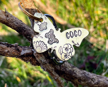 Load image into Gallery viewer, Daisy dog id tag, butterfly shaped pet tag, hand stamped with flowers