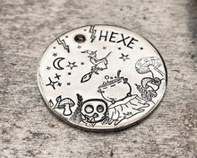 Load image into Gallery viewer, Metal dog id tag with witch on a broom and mushrooms, double-sided pet tag with up to 2 phone numbers