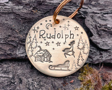 Load image into Gallery viewer, Christmas dog tag, hand stamped with Santa cabin and reindeer