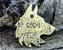 Load image into Gallery viewer, Wolf head dog tag, handstamped with wolf & trees