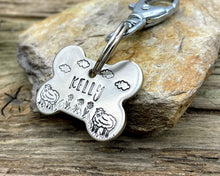 Load image into Gallery viewer, Bone dog id tag, handstamped with flowers and sheep