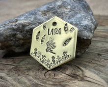 Load image into Gallery viewer, Hexagon dog tag, hand stamped with fairy design, flowers and feathers