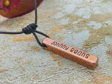 Load and play video in Gallery viewer, Dog memorial necklace with moon and star design, hand-stamped bar necklace with adjustable leather cord