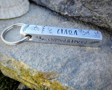 Load image into Gallery viewer, Bar tag, dog id tag, hand stamped with leaf design and 'chipped & loved'