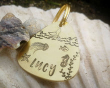 Load image into Gallery viewer, Guitar pick dog id tag, hand stamped with ocean design & whale