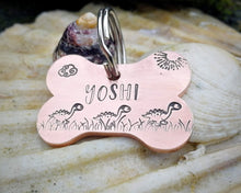 Load image into Gallery viewer, Bone dog tag, hand stamped with cute dino