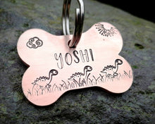 Load image into Gallery viewer, Bone dog tag, hand stamped with cute dino