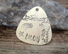 Load image into Gallery viewer, Guitar pick dog id tag, hand stamped with ocean design & whale