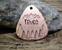 Load image into Gallery viewer, Guitar pick dog tag, hand stamped with mountains & trees