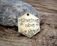 Load image into Gallery viewer, Hexagon dog tag, hand stamped with nautical design, octopus & fish