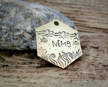 Load image into Gallery viewer, Hexagon dog tag, hand stamped with nautical design, octopus & fish