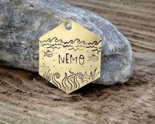 Load image into Gallery viewer, Hexagon dog tag, hand stamped with nautical design, octopus & fish