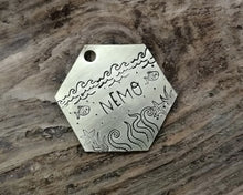 Load image into Gallery viewer, Hexagon dog tag, hand stamped with nautical design, octopus & fish