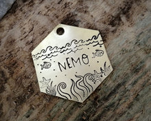 Load image into Gallery viewer, Hexagon dog tag, hand stamped with nautical design, octopus & fish