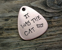 Load image into Gallery viewer, Guitar pick dog tag, hand stamped with 'it was the cat'