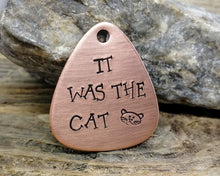 Load image into Gallery viewer, Guitar pick dog tag, hand stamped with 'it was the cat'