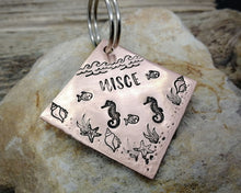Load image into Gallery viewer, Square dog id tag, hand stamped with ocean design, seahorse & fish