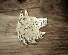 Load image into Gallery viewer, Wolf head dog tag, handstamped with howling wolf, trees and moon