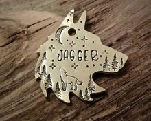 Load image into Gallery viewer, Wolf head dog tag, handstamped with howling wolf, trees and moon