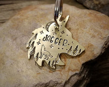 Load image into Gallery viewer, Wolf head dog tag, handstamped with howling wolf, trees and moon