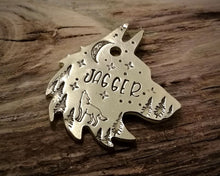 Load image into Gallery viewer, Wolf head dog tag, handstamped with howling wolf, trees and moon